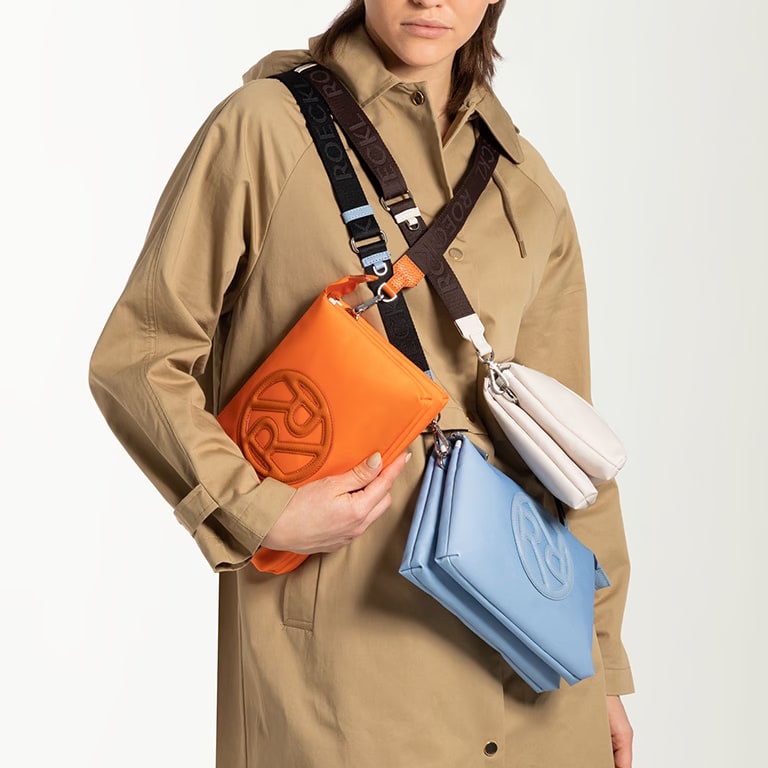 The shoulder bag Nala in orange, blue and beige recycled nylon.
