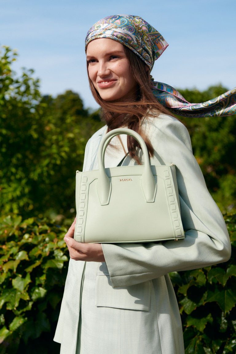 The Mathilde crafted small handbag by Roeckl in mint green is a true work of craftsmanship and the perfect handbag for special occasions.